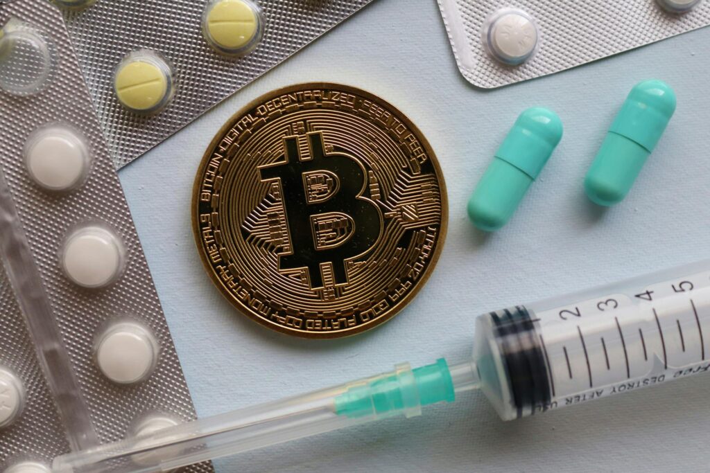 Bitcoin and pills on a table in a hospital